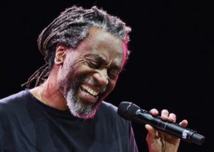 FILE - In this Jan. 27, 2010 file photo, Bobby McFerrin performs at the jazz festival in Kiev, Ukraine. Paul Simon probably never had a vocal partner quite like Bobby McFerrin, who coaxed him onstage for an impromptu performance of a Simon and Garfunkel hit _ the highlight of opening night of Jazz at Lincoln Center's 25th anniversary season, Friday, Sept. 14, 2012 in New York. (AP Photo/Efrem Lukatsky, File)